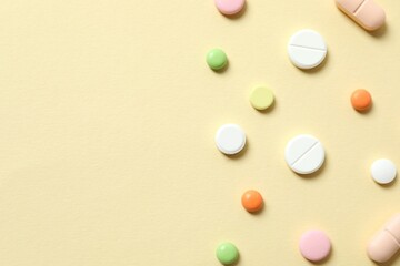 Various medicine pills on color background