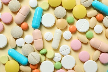 Various medicine pills on color background
