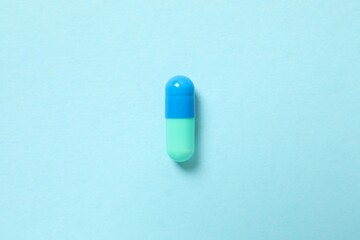 Medicine pill on color background