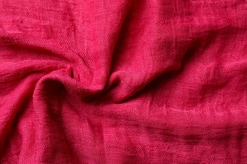 Pink fabric background, top view