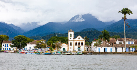 Panoramic view of Paraty Bay, historic center of Paraty and tourist boats at the pier in Rio de...