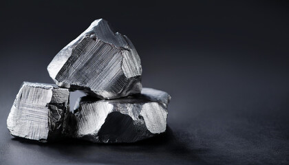 Niob. mineral stone on black background. fragment of metal niobium columbium