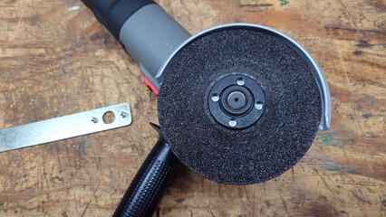 abrasive mesh fiber wheel installed on 4.5" electric grinder for rust and paint removal