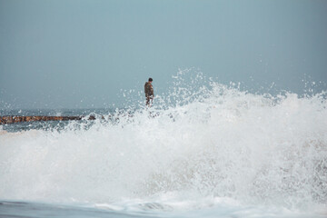 Soldier on Pier in Stormy, Foggy Weather