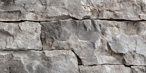 Weathered stone texture with deep cracks and subtle dark shading, giving a sense of history and roughness in monochrome gray tones