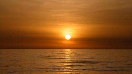 Calm sea in the evening silence in orange tones, relax.