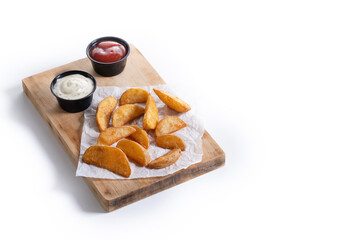 Fried potato wedges with sauces isolated on white background. Copy space
