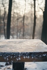 Wooden bench surrounded by snow in a forest setting, great for winter scenes or outdoor activities