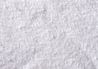 Texture clothes in spools close-up with copy space. Problem of poor quality clothing and quick wear