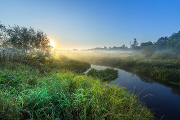 Naklejka premium A river with a sun in the sky