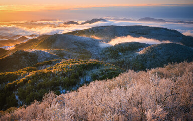 sunrise over the snowy mountains in spring