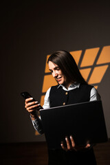 A young freelancer woman takes a selfie with a laptop in the office. The concept of remote work