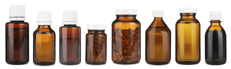 Many different glass bottles isolated on white