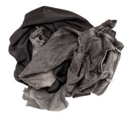 Crumpled pile of dark gray clothes on transparent background. Top view, high angle, flat lay. Ideal for themes related to fashion, laundry, recycling. Cut out clothing.