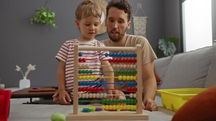 Father teaching son with colorful abacus in cozy living room, showcasing family bonding, childhood education, and indoor warmth