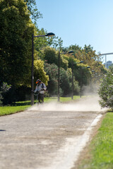 Fototapeta premium a worker with a hand-held lawn