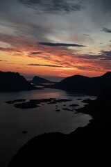 Sunset over coastal landscape with silhouetted islands