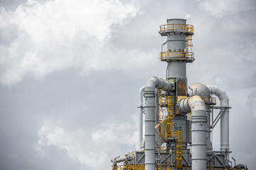 Oil petroleum refinery plant building distillation columns tower, Closeup part of fuel gas pipe...