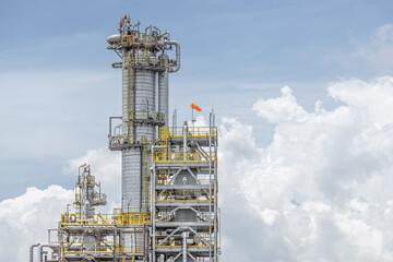 Oil petroleum refinery plant building distillation columns tower, Closeup part of fuel gas pipe...