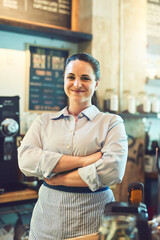 Crossed arms, woman and portrait of barista in restaurant with confidence for food industry. Happy, pride and server from London with smile for hospitality career in cafe with professional service.