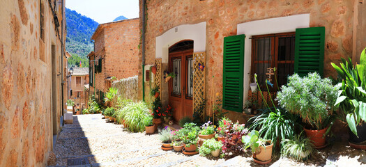 Mallorca (Majorca) island- traditional village  Fornalutx with charming floral street decoration. Popular tourist attraction. Spain, Balearic islands