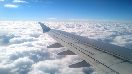 Airplane wing in flight above clouds, symbolizing air travel and international transport