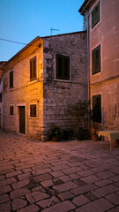 Poreč old town seen from the sea shore and it's narrow streets at dusk