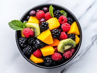 Top view of a colorful fruit salad with fresh berries