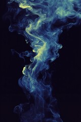 Obraz premium Abstract swirling blue and yellow smoke on a dark background, creating a vibrant, ethereal effect with flowing shapes and a mysterious, dreamlike atmosphere