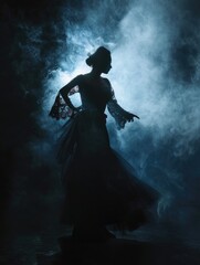 Woman in a black dress is silhouetted against a dark background
