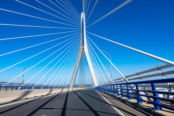 Naklejka premium View on cable-stayed bridge with high pylons&nbsp;across the&nbsp;Bay of Cadiz, linking&nbsp;Cadiz&nbsp;with&nbsp;Puerto Real&nbsp;in mainland Spain