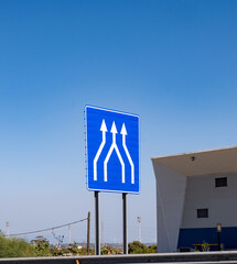 Driving car or family camper in summer, road signs and directions, no traffic jam on touristic road in Andalusia, Spain