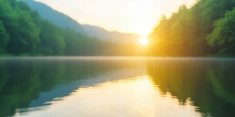 Fototapeta premium Serene sunrise over tranquil lake, reflecting mountains and lush greenery.