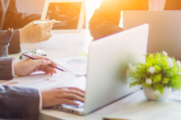 Business people in the conference room are introducing and consulting each other to create good...