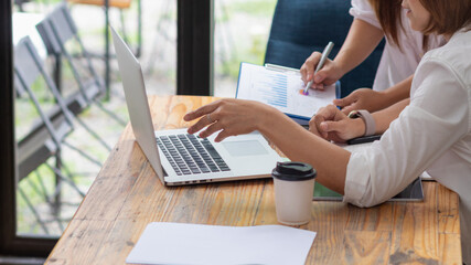 Businessmen and business advisors are discussing past results to improve and fix their investments to make their business better. Investment ideas and consulting with business people for good benefits