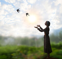 Young girl praying to God