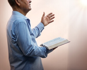 A man with a bible preaches