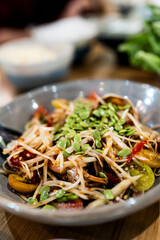 Papaya salad with crab and fermented fish decoration seed Acacia, a popular food among Thai people