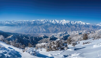 Snowy Mountain Range with a Clear Blue Sky