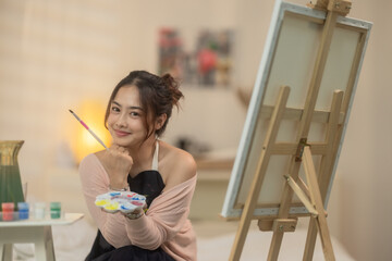 Woman Painting at Home Studio