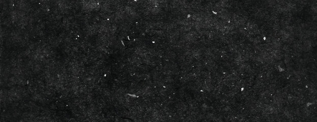 Dark black background, textured with speckles. The background is gritty and black, providing a rugged, black background effect. Minimal grunge speckled texture vector background
