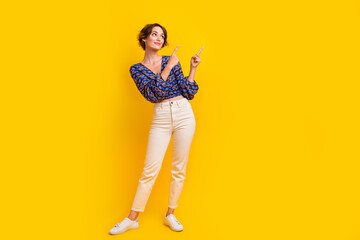 Full body size photo of young slim model woman indicating fingers product which helps dieting isolated on yellow color background