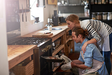 Couple, bread and oven with baking tray in kitchen for home made wheat, snack or meal together....