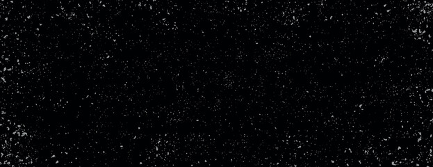 A black background with a speckled texture. The background is black with a starry effect. Perfect for a cosmic-themed background. Minimal grainy speckled texture background vector
