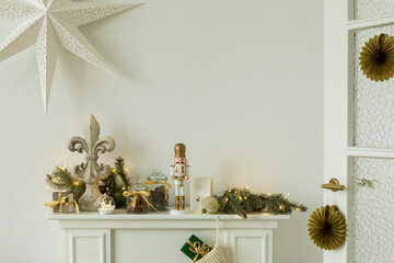 Elegant holiday mantel decor with a nutcracker, garland, and fleur-de-lis ornament. A cozy setup...