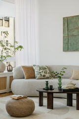 Bright, cozy living room with soft textures, greenery, and earthy tones. A perfect blend of comfort...