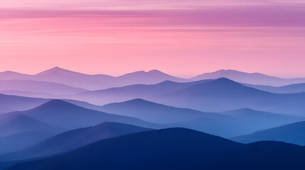 Fototapeta premium Serene layered mountains at sunset with a hazy pink sky.