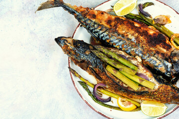 Baked mackerel with asparagus.