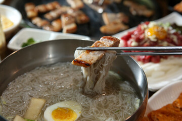 Korean food. cold buckwheat noodles with pork belly bbq
