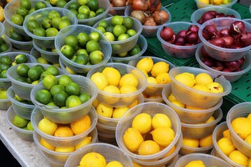 Lemons and limes at a greengrocers shop, UK